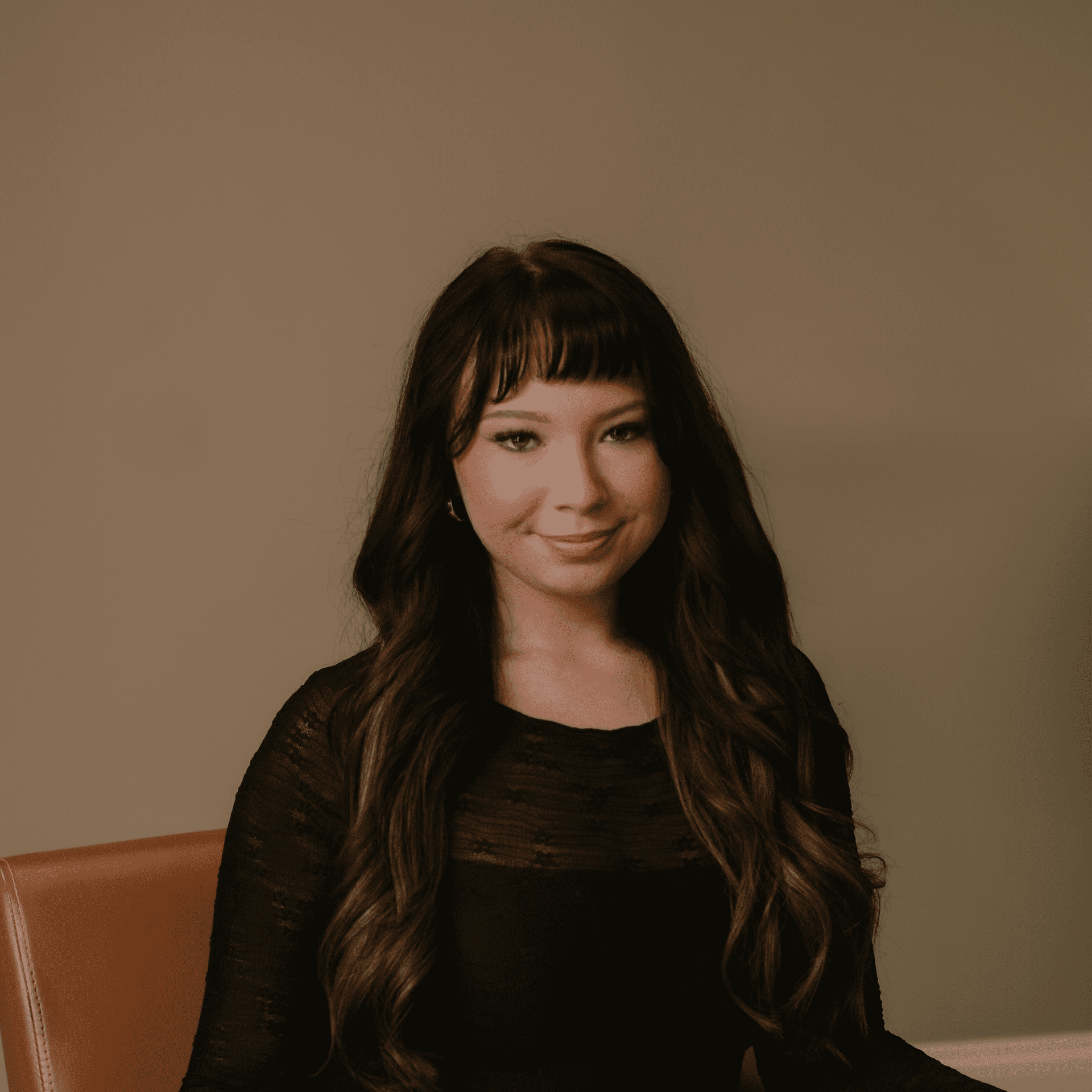 Portrait of Destiny LaGamba, a professional stylist at Studio 1921, showcasing their expertise and style.